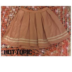Hot Topic pleated pink skirt with white stripes on the edge.